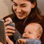 baby and mom watching baby sensory video on tablet