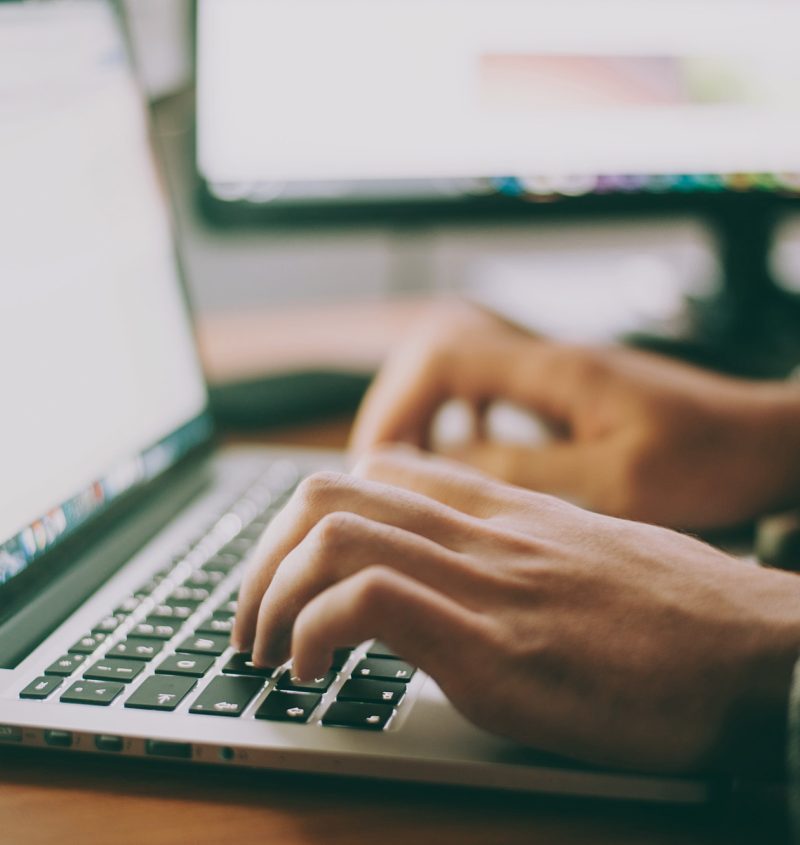 Person using an Apple laptop